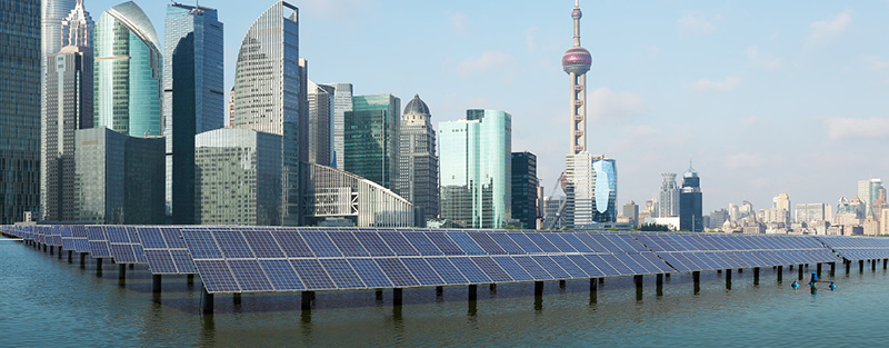 Solar power plant with Shanghai skyline.