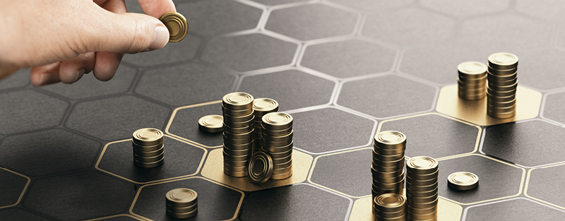 Image of human hand stacking generic coins over a black background with hexagonal golden shapes. Concept of investment management and portfolio diversification. 