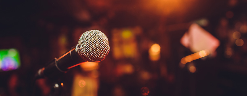 Microphone on stage in an auditorium.