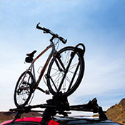 Image of mountain bike in bike rack on top of car