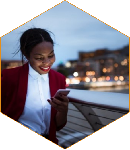 BIPOC woman looking at her mobile phone.