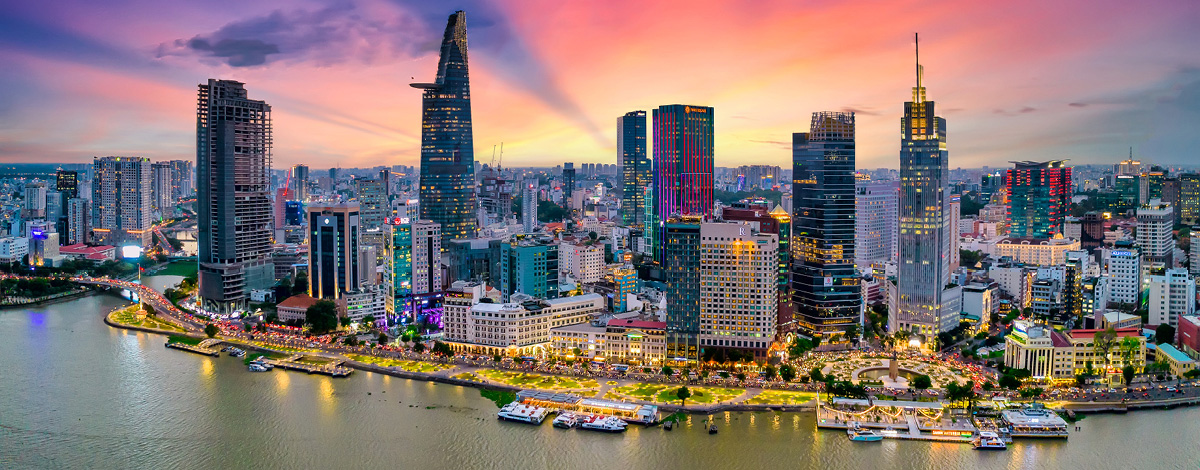 Aerial view of Ho Chi Minh City, Vietnam, along the river at sunset.