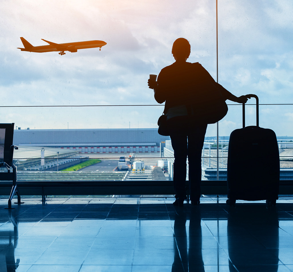 Silhouette of a passenger waiting in an airport.