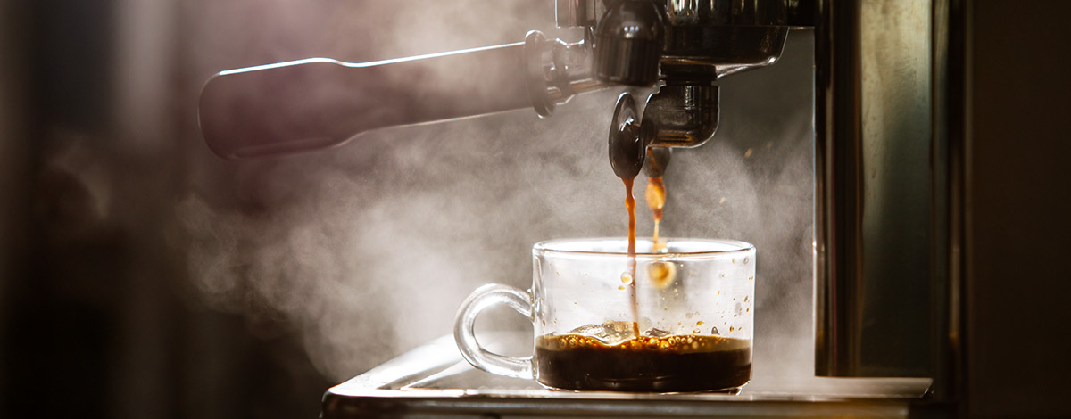 Brewing espresso coffee using a high pressured espresso machine.