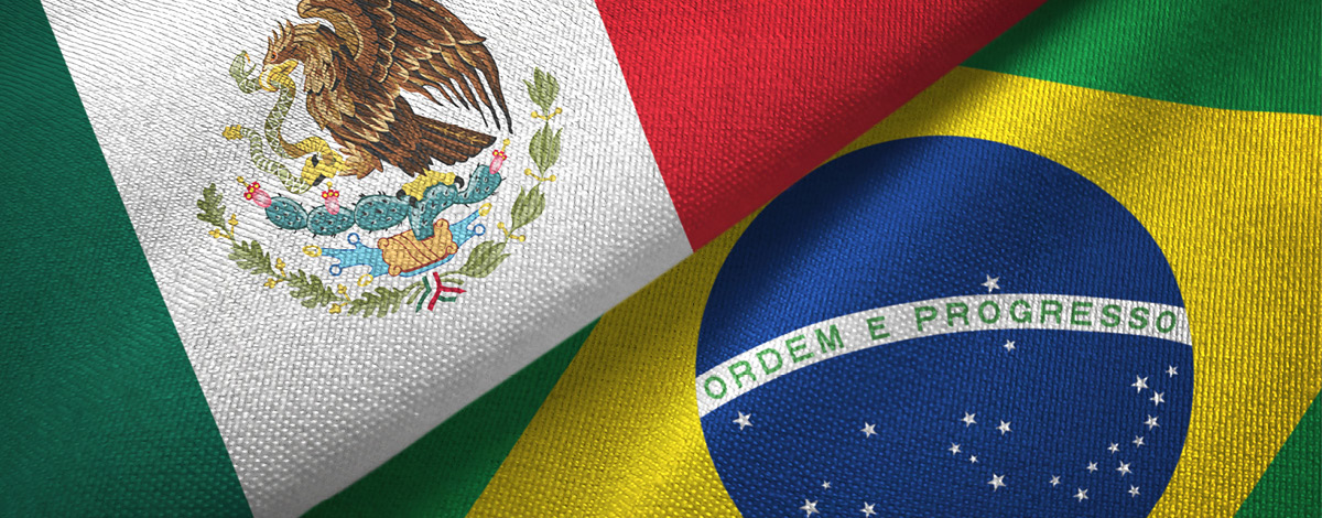 The two flags for Mexico and Brazil on textile cloth.