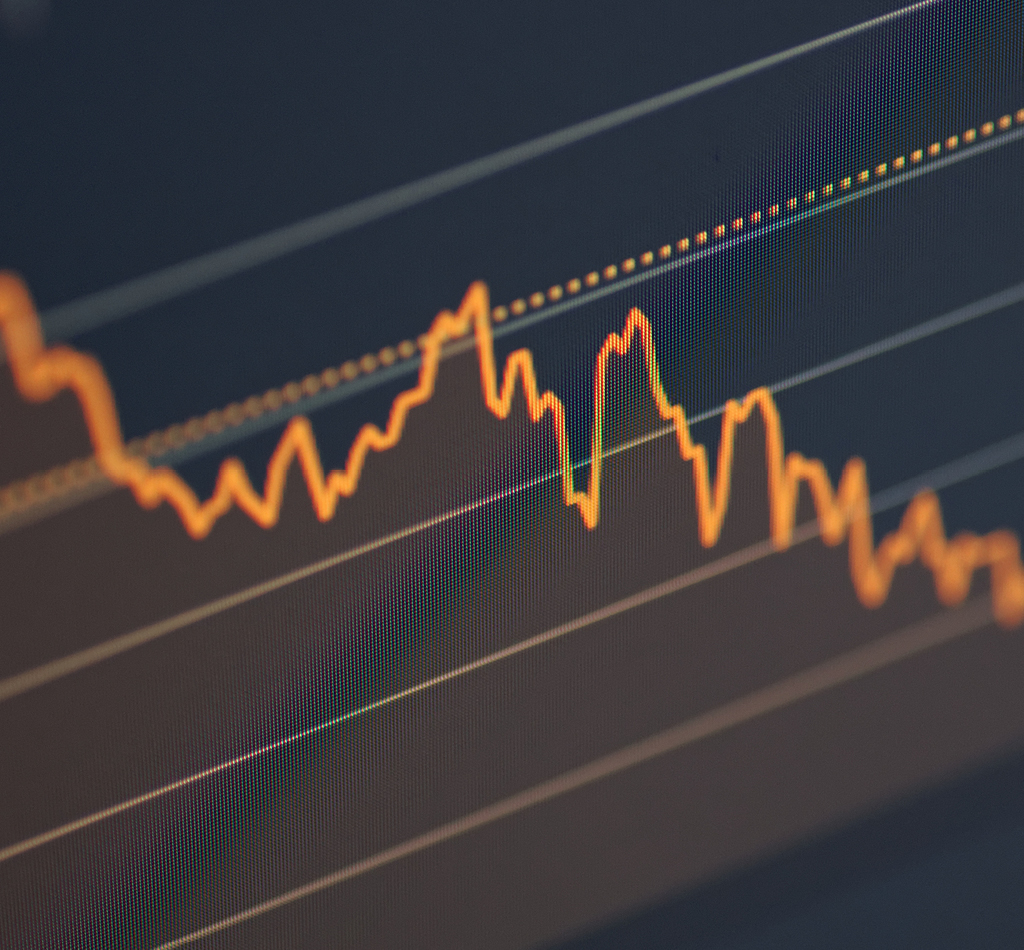 Stock market chart on LCD screen. Selective focus.