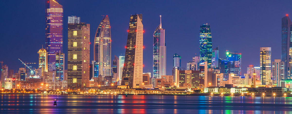 Kuwait skyline view from beach at night.