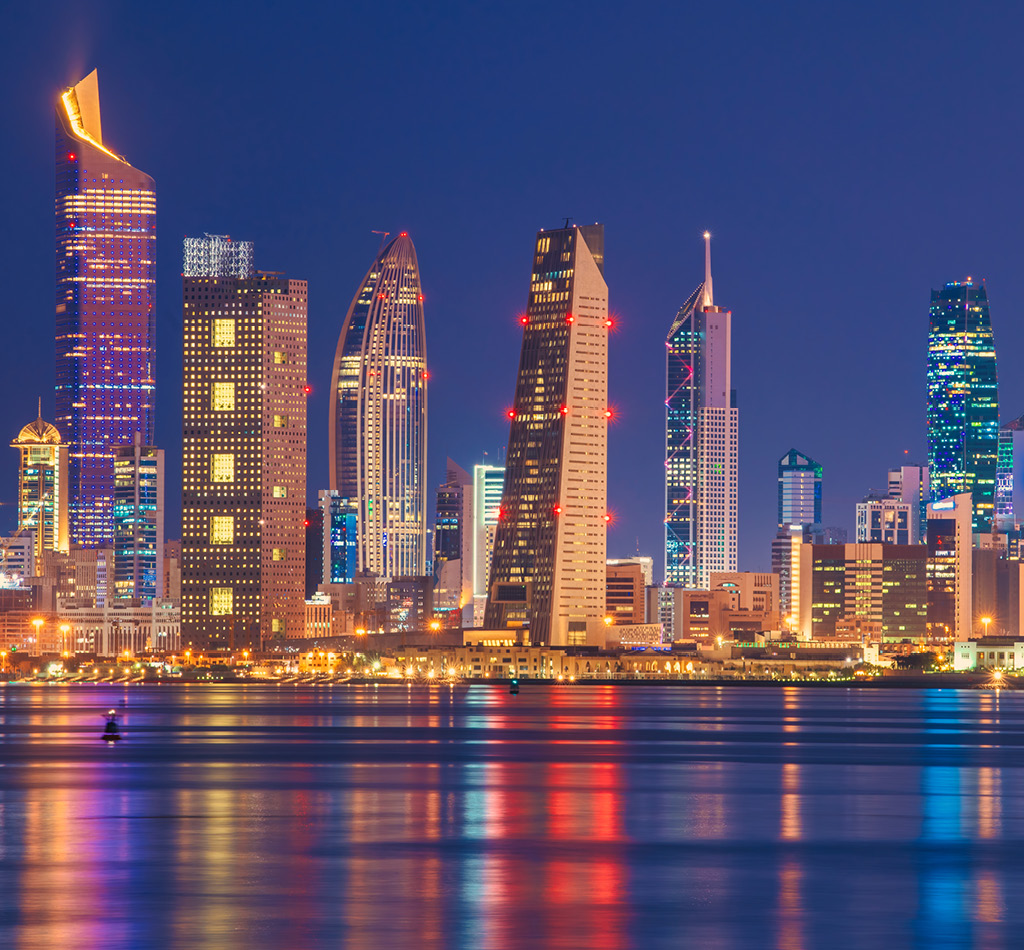 Kuwait skyline view from beach at night.