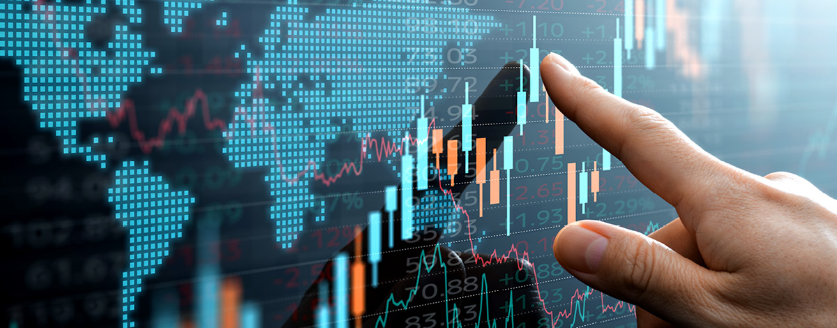 Investor pointing at a chart showing data with a sharp increase.