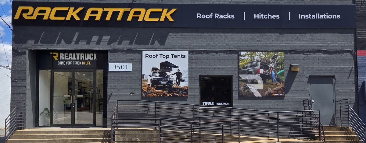 RealTruck product posters displayed on the exterior of Rack Attack store - a Banyan Capital Partners portfolio company.