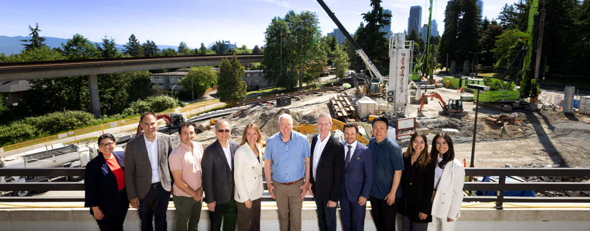 Photo of the Crestpoint team in front of the King + Park construction site.