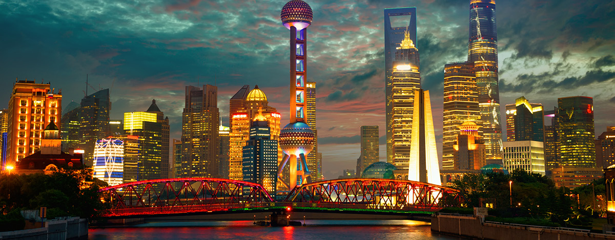 Shanghai skyline at dusk with Garden Bridge, China.